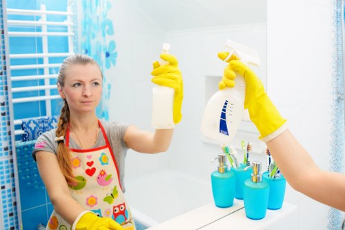 Carpet cleaning team applying safe working practices during a service