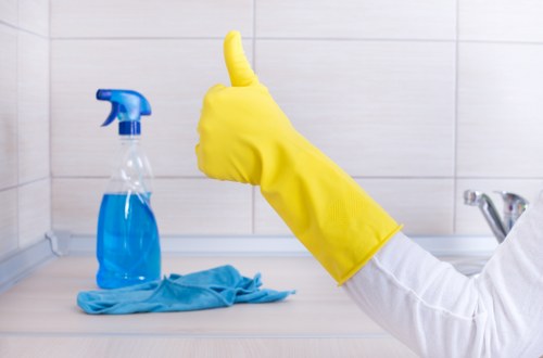 Cleaner treating sofa stains in a Hackney Marshes home