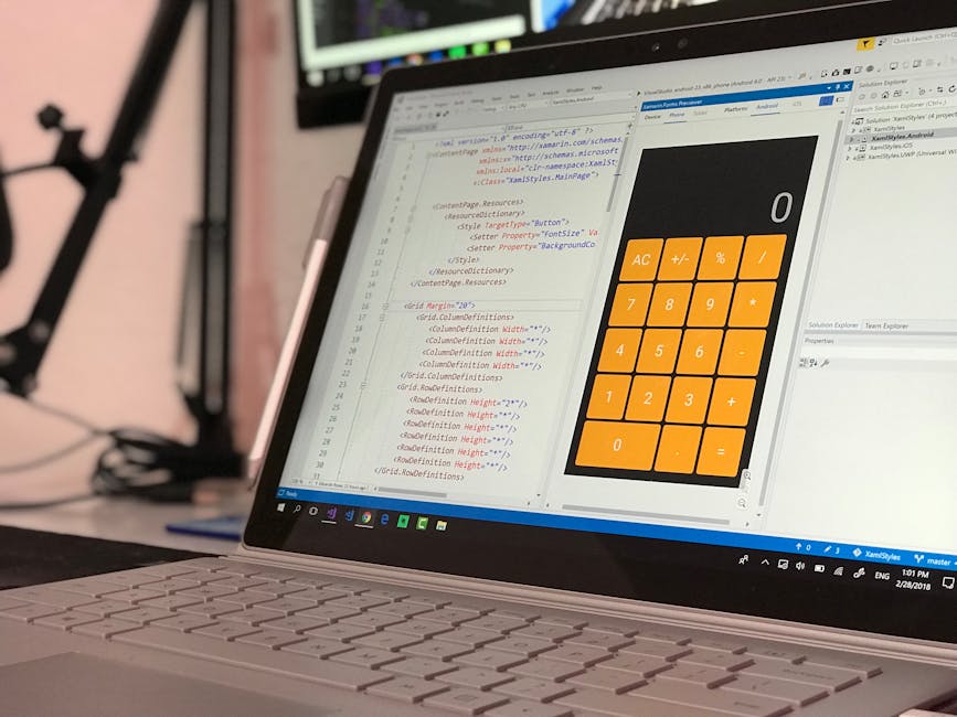 Close-up image of a dark green surface with visible code and HTML tags in yellow and orange text, including 'table', 'width', 'height', 'padding', and 'form'. The surface appears to be a computer scre
